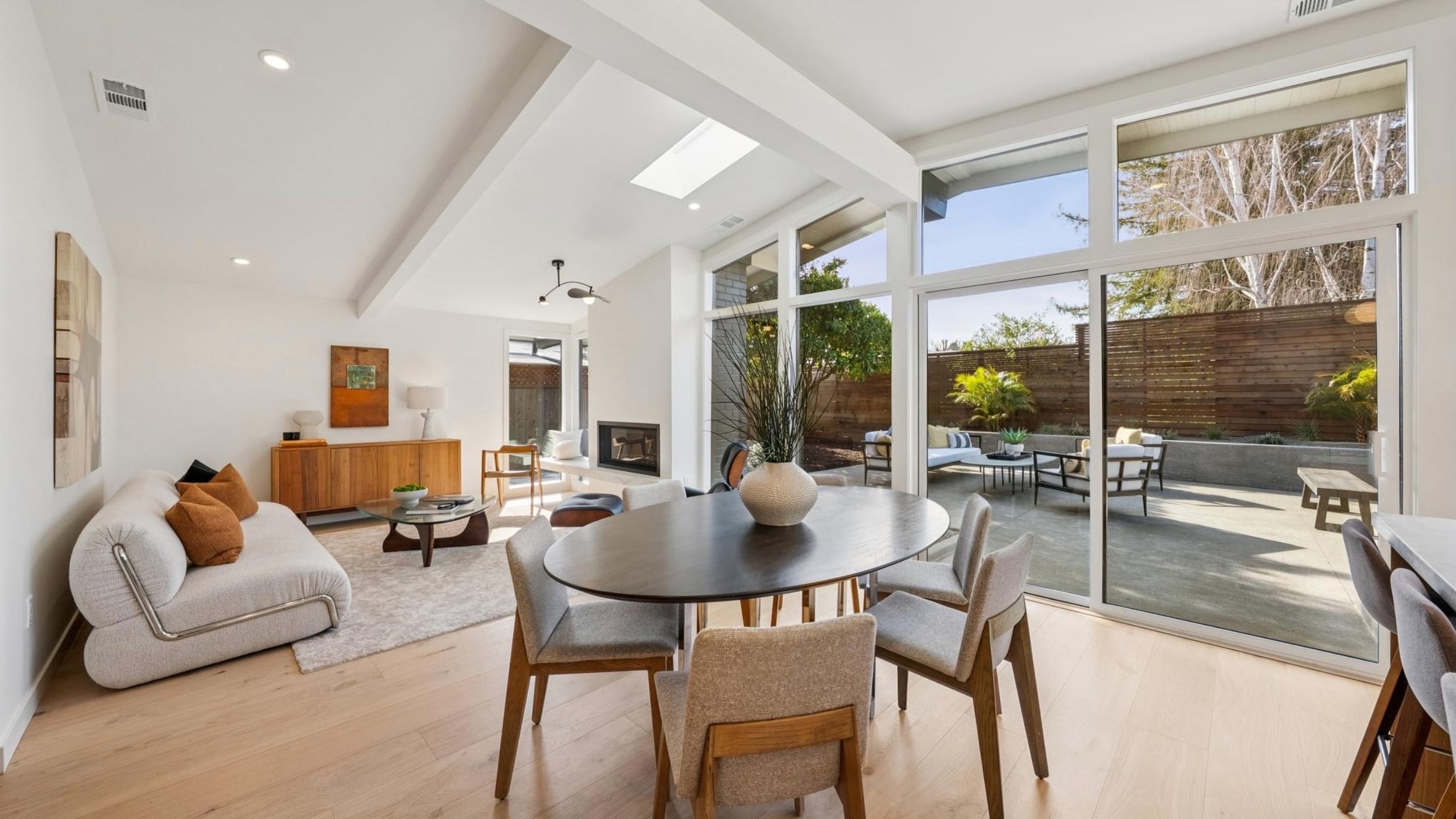 Modern open-plan living room with large windows.