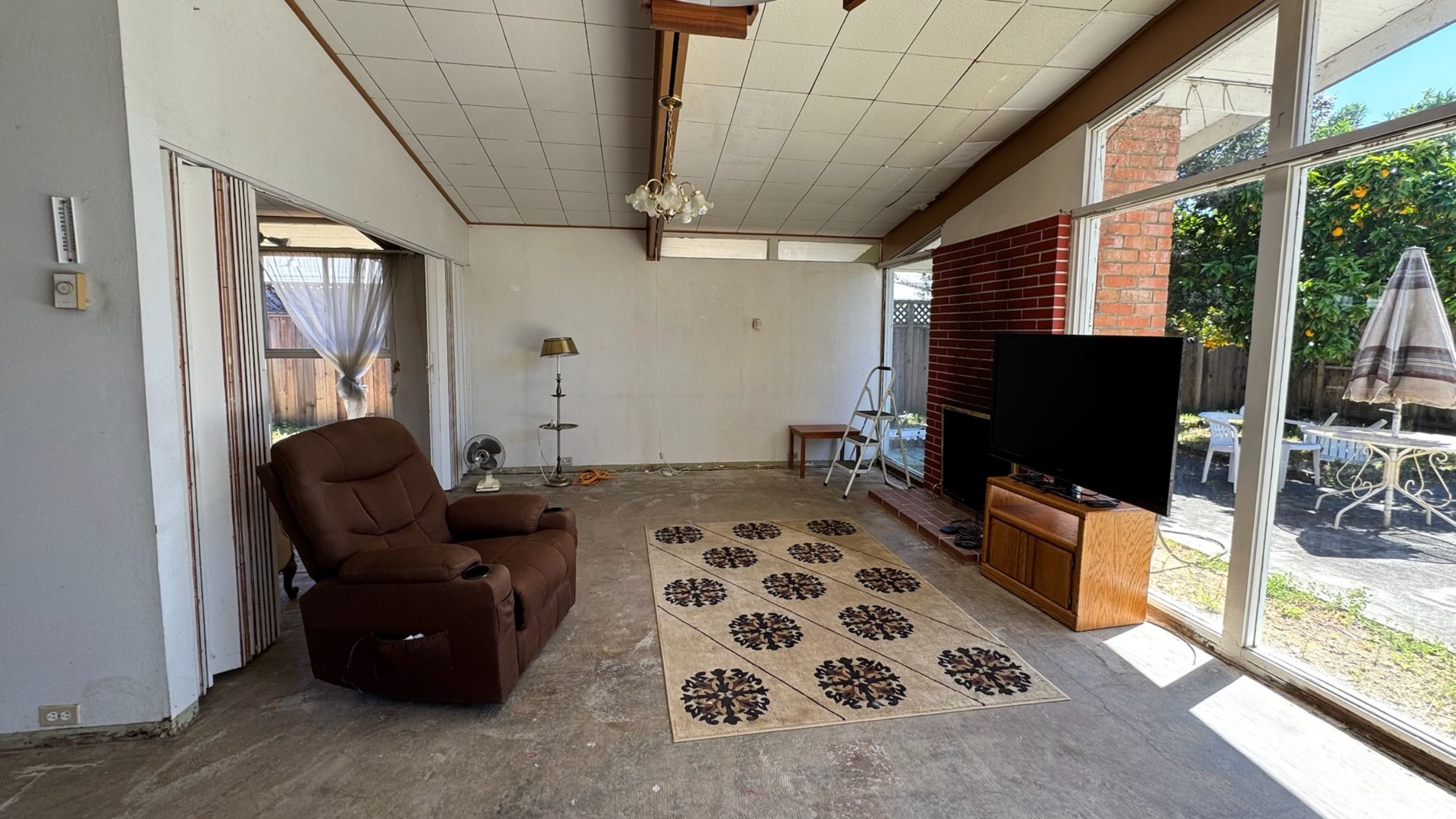 Living room with recliner and TV setup.